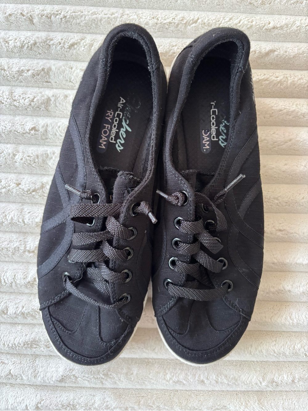 Skechers Women's Black Canvas Lace-Up Sneakers with Subtle Stitching